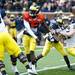Defensive end Brennen Beyer attempts to get to the quarterback during the Michigan spring football game on Saturday, April 13. AnnArbor.com I Daniel Brenner